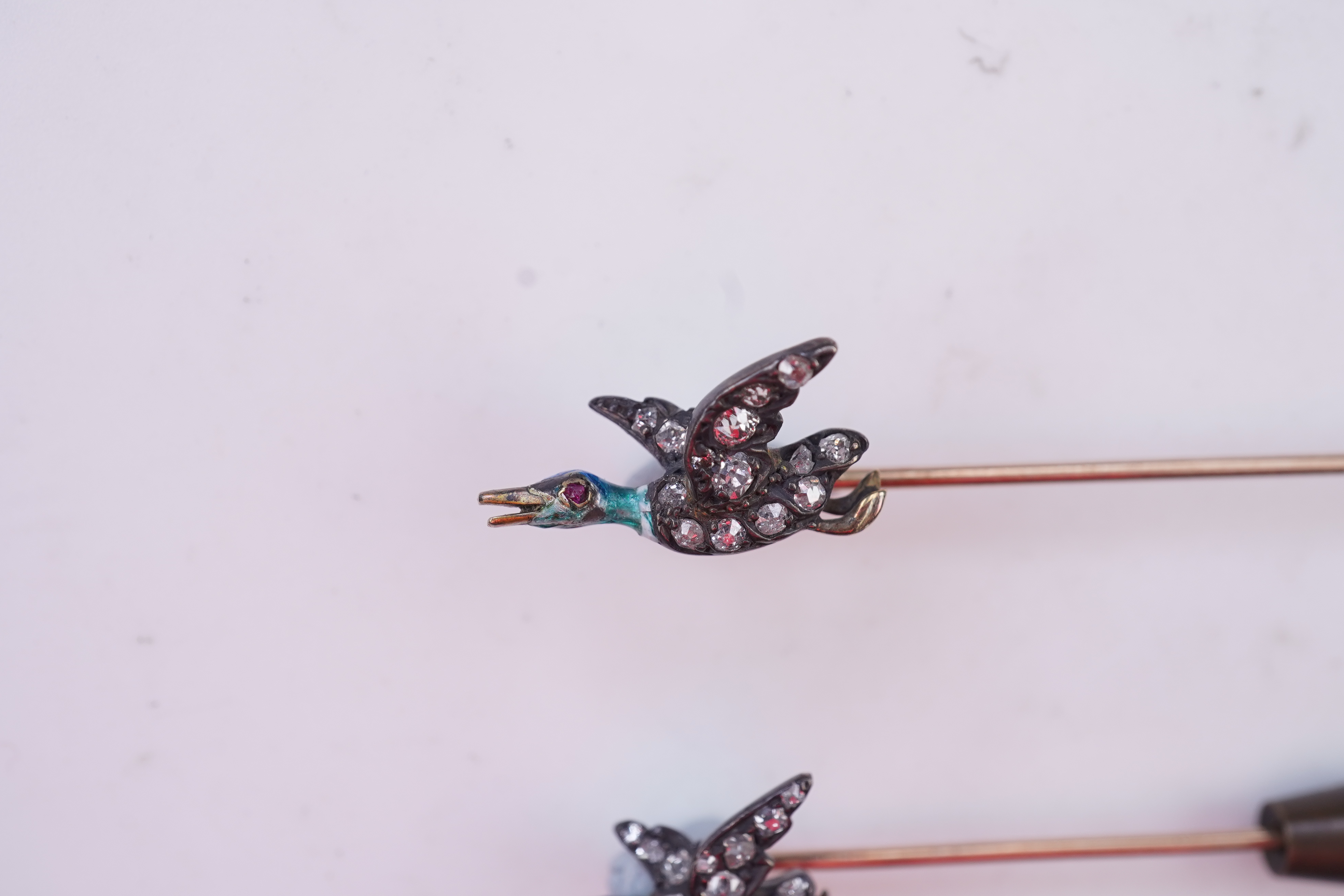 A pair of novelty enamel and diamond stick pins, circa 1900